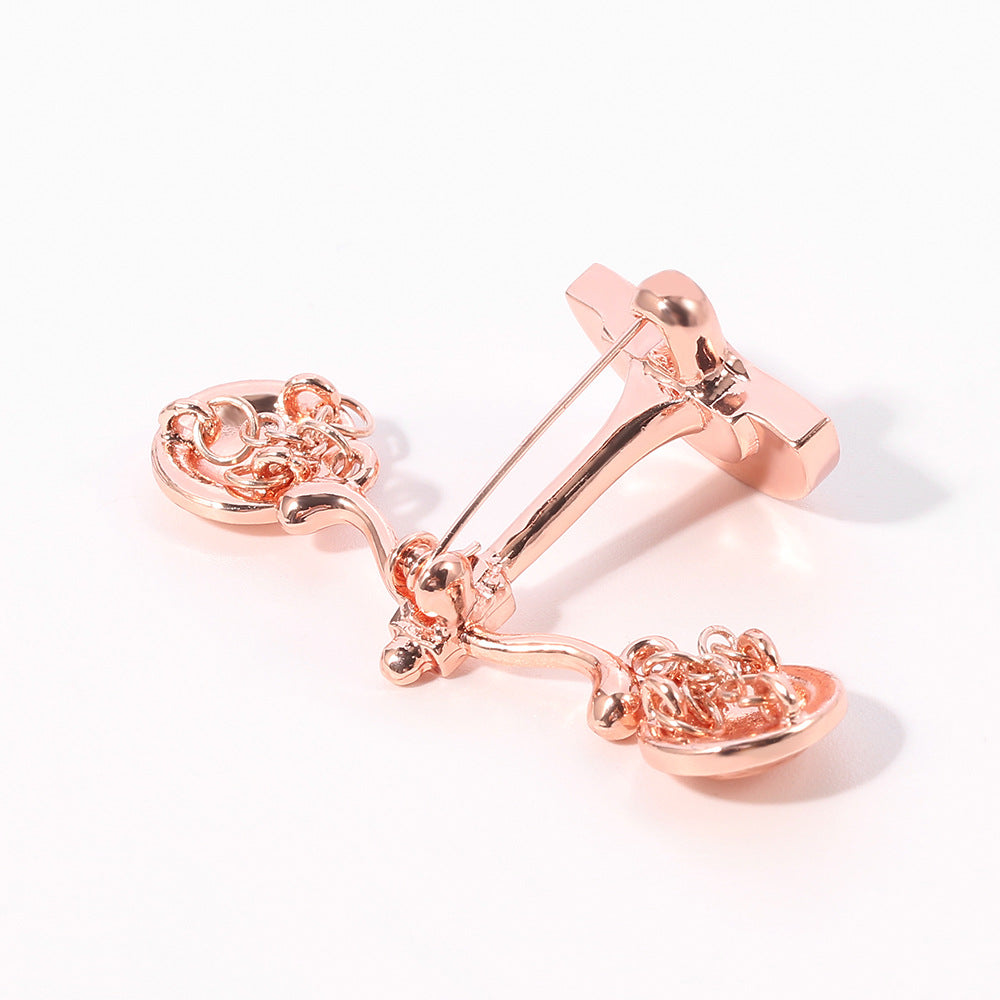 Valenedit | Balance Pin, Crafted in zinc alloy with a rose gold–tinted finish