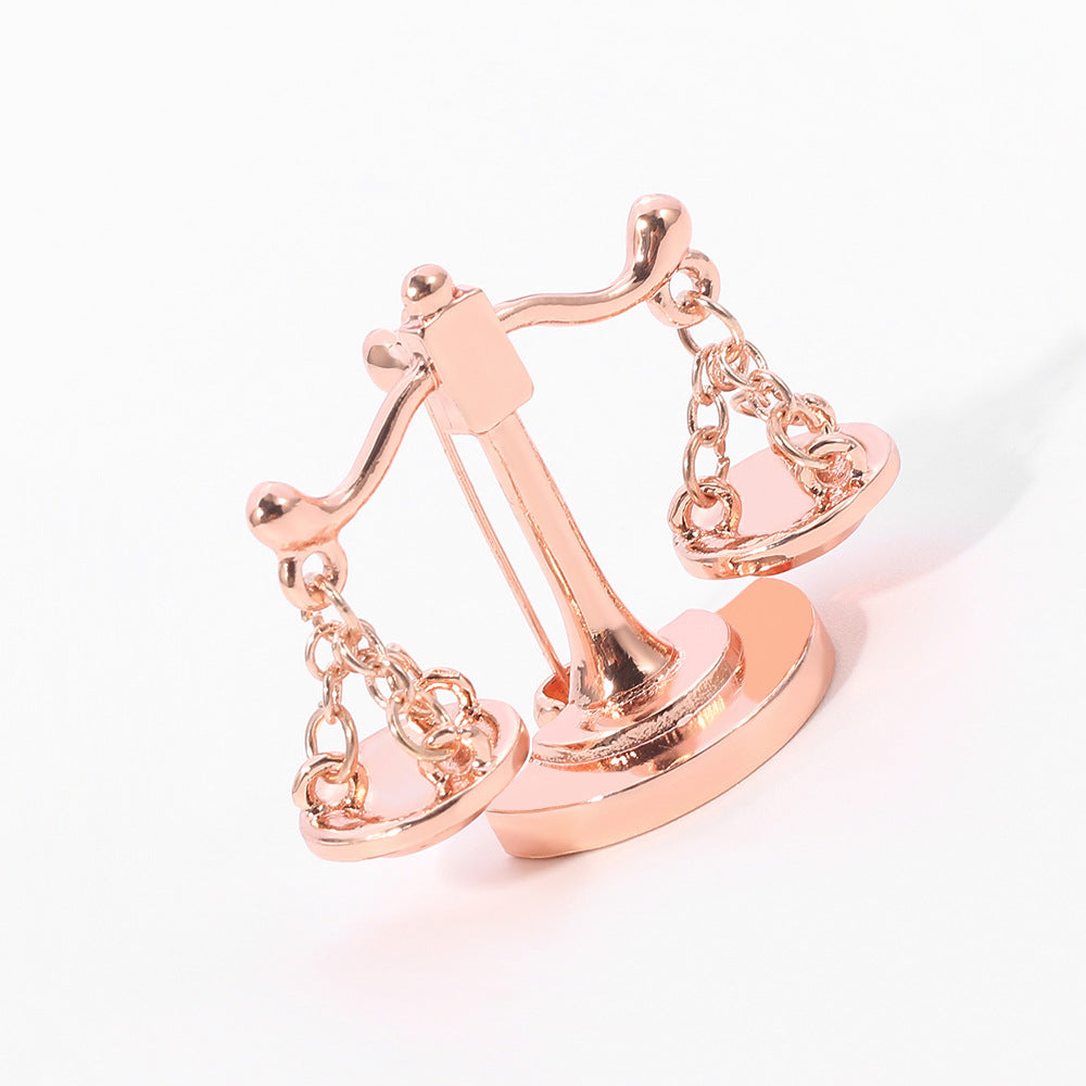 Valenedit | Balance Pin, Crafted in zinc alloy with a rose gold–tinted finish
