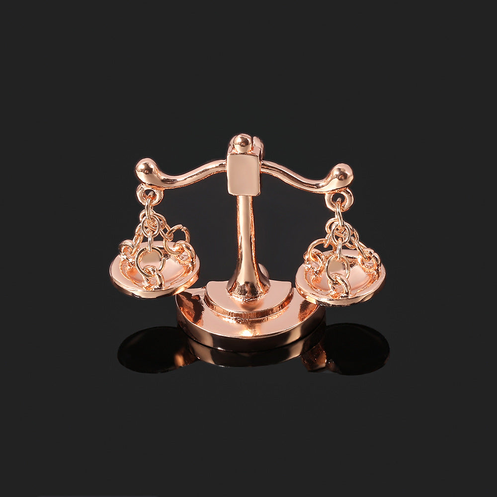 Valenedit | Balance Pin, Crafted in zinc alloy with a rose gold–tinted finish