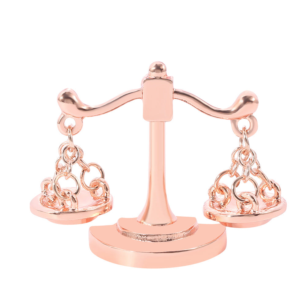 Valenedit | Balance Pin, Crafted in zinc alloy with a rose gold–tinted finish